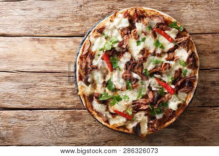Fresh Pizza With Pulled Pork, Mozzarella Cheese, Chilli And Barbecue Sauce Close-up. Horizontal Top