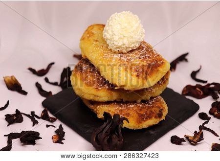 Fried Cheesecakes On A White Background With The Addition Of Kakrkade With Delicious Rafaello