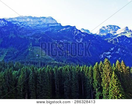 Mountain Hikers On The Alpine Peak Of Margelchopf And In The Alviergruppe Mountain Range - Canton Of