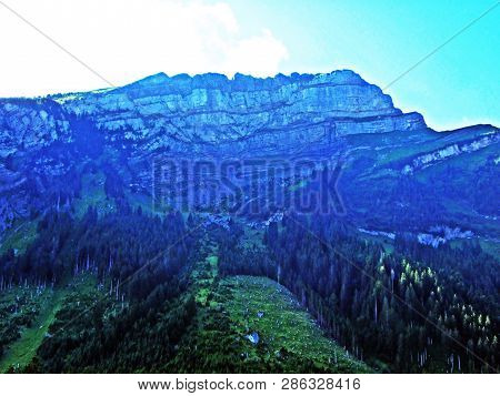 Mountain Hikers On The Alpine Peak Of Margelchopf And In The Alviergruppe Mountain Range - Canton Of