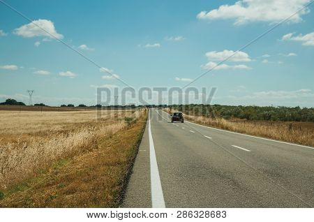 Road Through Rural Landscape And Car Near The Monfrague National Park