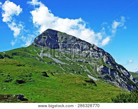 Mountain Hikers On The Alpine Peak Of Margelchopf And In The Alviergruppe Mountain Range - Canton Of