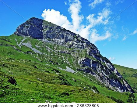 Mountain Hikers On The Alpine Peak Of Margelchopf And In The Alviergruppe Mountain Range - Canton Of