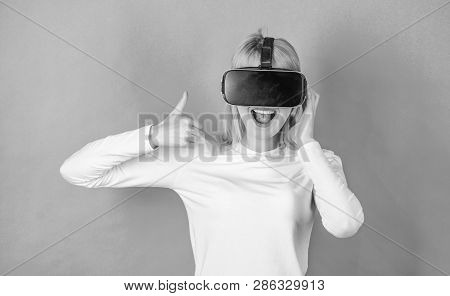 Woman With Virtual Reality Headset. Pretty Woman Playing Game In Virtual Reality Glasses. A Person I