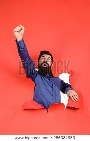 Success. Luck. Bearded Man Raises Fist Up. Business. Advertising. Sale. Through Paper. Baerded Man T