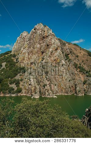 Valley With Cliffs And The Tagus River At The Monfrague National Park