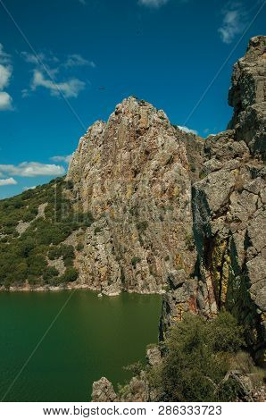 Valley With Cliffs And The Tagus River At The Monfrague National Park