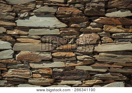 Wall Made Of Slate Stone Making A Quaint Pattern
