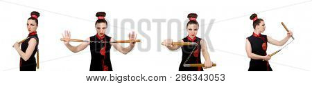Funny woman with nunchucks isolated on white