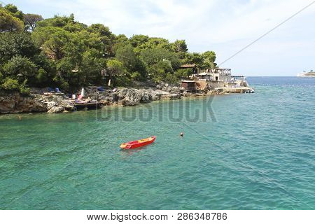 Canoe In Sea. Montenegro. Zanjic Beach, Travel Concept
