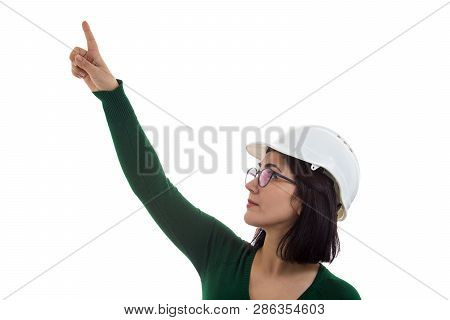 Positive Young Woman Engineer Wearing Protective Helmet Pointing Index Finger Up Isolated Over White