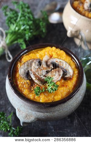 Vegetable Carrot Soup With Mushroom And Parsley Dressing In Two Ceramic Tureen. Rustic Style