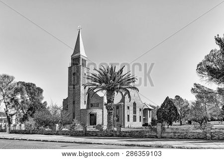 De Aar, South Africa, August 6, 2018: A Street Scene, With The Reformed Church, In De Aar In The Nor