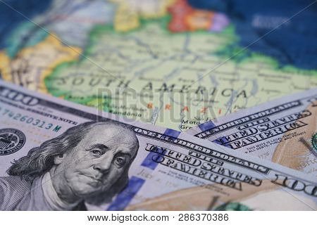 Us Dollars On The Map Of South America. American Investment And Trading With Latin America And Brazi