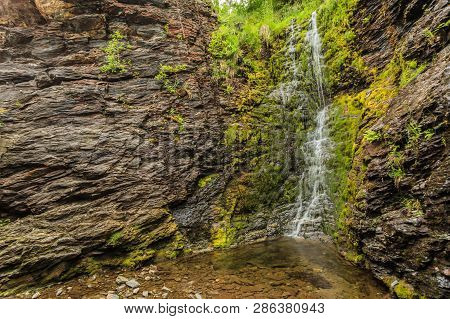 Little Waterfall In Green Summer Mountains, Norway.