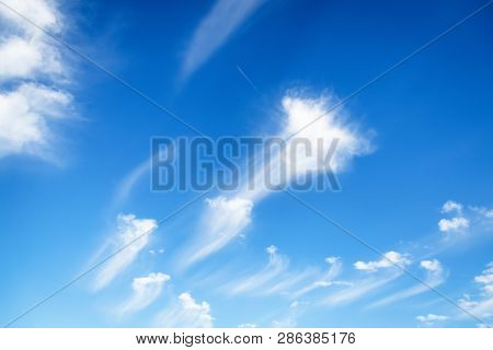 Beautiful White Clouds On A Blue Sky Background. Clouds Like A Brush Strokes