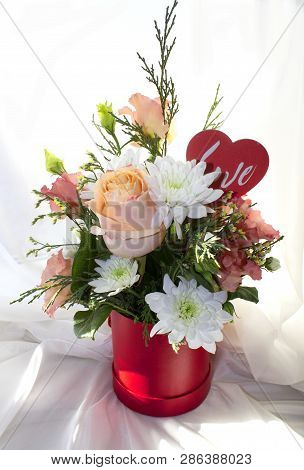 Valentine's Day Concept. Beautiful Bouquet Of Flowers With Heart Shape Sign