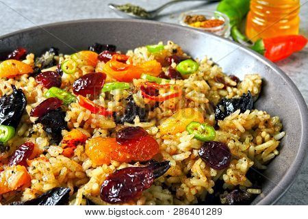 Spicy Rice With Spices And Dried Fruits. Vegan Bowl. Healthy Eating Rice With Spices. Food For Weigh