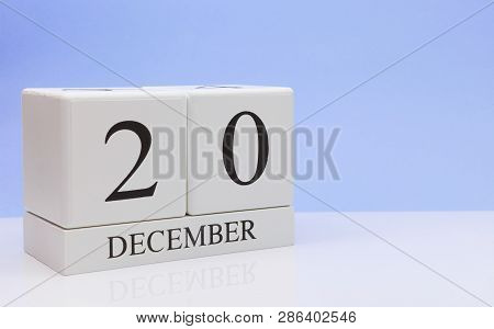 December 20st. Day 20 Of Month, Daily Calendar On White Table With Reflection, With Light Blue Backg
