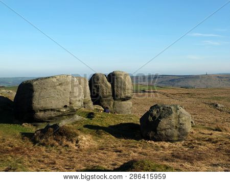 Rock Formations In Bridestones Moor In West Yorkshire With A Panoramic View Over Pennine Countryside