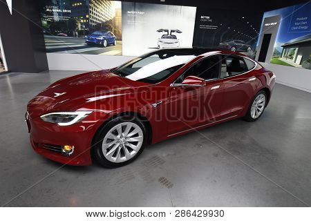 Tesla Deep Red Model S 100d All Electric Car On Display At A Tesla Car Dealership, Chicago, Il Novem