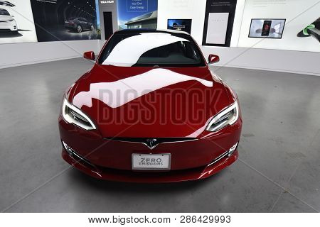 Tesla Deep Red Model S 100d All Electric Car On Display At A Tesla Car Dealership, Chicago, Il Novem