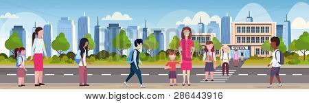Parents With Children Crossing Crosswalk Pupils Walking In Front Of School Building Primary Schoolch