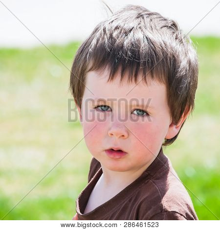 Little Boy Looking Over His Shoulder