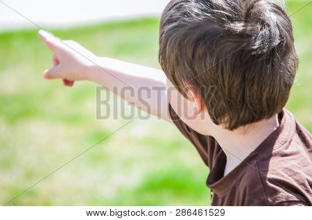 Very Young Boy Pointing His Finger.