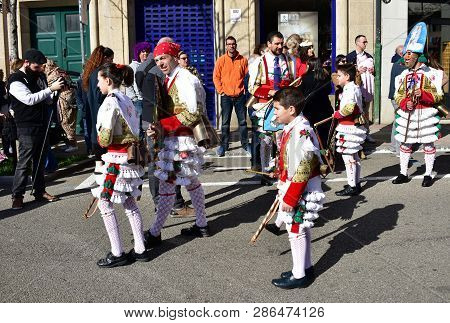 Verin, Spain, 24 Feb 2019. Famous Carnival And Street Parade With Cigarrons Costumes. Ourense Provin