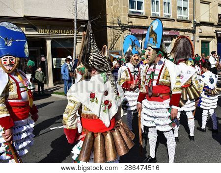 Verin, Spain, 24 Feb 2019. Famous Carnival And Street Parade With Cigarrons Costumes. Ourense Provin