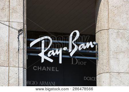 Milan, Italy - 2 June, 2018: Logo Of The Ray-ban Store On The Street Of Milan In Italy.
