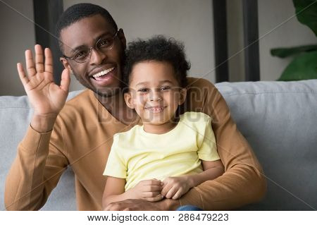 Happy African Father And Kid Son Waving Hands Recording Vlog