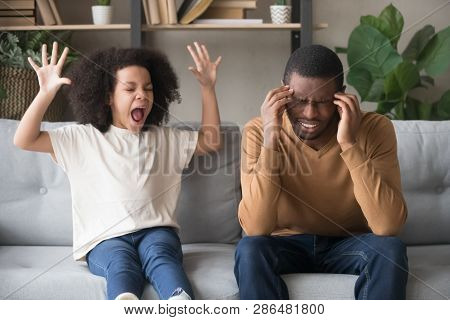 Stubborn African Child Girl In Tantrum Screaming At Black Father