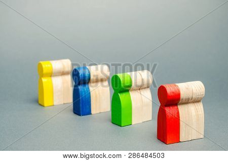 Groups Of Multicolored Wooden People. The Concept Of Market Segmentation. Target Audience, Customer 