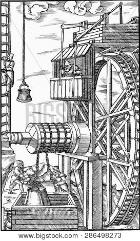 Extraction machine driven by hydraulic force in a mine, vintage engraved illustration. From the Universe and Humanity, 1910.
