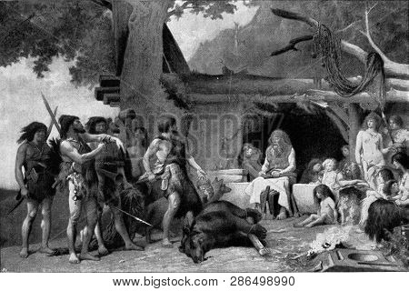 Men of the Stone Age, vintage engraved illustration. From the Universe and Humanity, 1910.