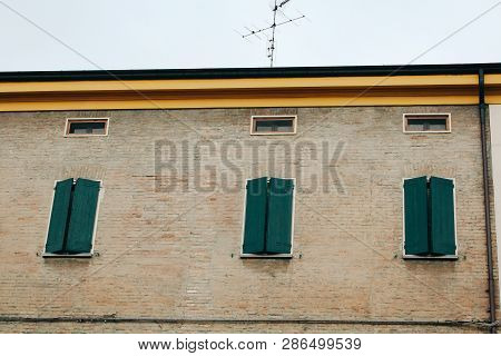 Maranello, Italy - 03 26 2013: View Of The Streets Of Maranello. Windows With Blindes On The House