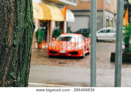 Maranello, Italy - 03 26 2013: Ferrari Sport Car On The Street. View Of The Streets Of Maranello.