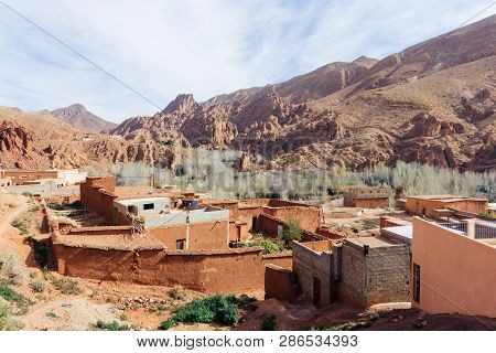Berber Village In Mountains. Morocco Tourism: Trekking Man In Mountains. Atlas Mountains, Jebel Sakh