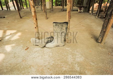 Dirty Rubber Boots At The Construction Sute