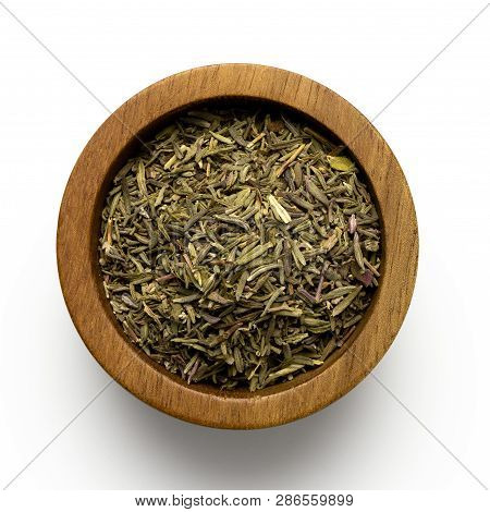 Dried Rubbed Thyme In A Dark Wood Bowl Isolated On White From  Above.