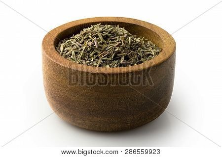 Dried Rubbed Thyme In A Dark Wood Bowl Isolated On White.