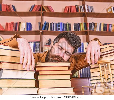 Teacher Or Student With Beard Fall Asleep On Books, Defocused. Overstudied Concept. Man On Sleeping 