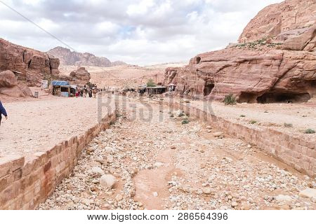 Petra, Jordan - February 8, 2019: Dry Canal In Petra (red Rose City), Jordan. Petra Is Unesco World 