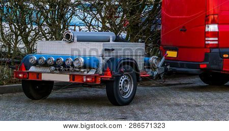Basic Fire Department Equipment, Trailer With Fire Hose And Fittings, Trailer Mounted On A Red Bus