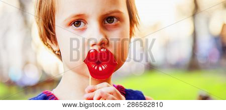 Healthy Mental And Emotional Development Concept. Funny Cutel Little Child Girl Playing With Fake Li