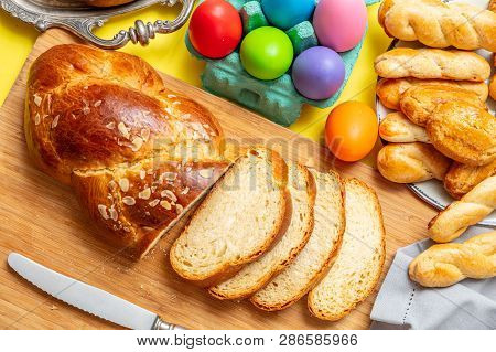 Easter Eggs And Tsoureki Braid, Greek Easter Sweet Bread, On Wood