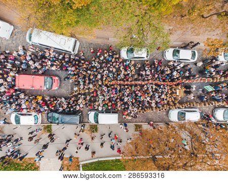 Lviv, Ukraine - October 7, 2018: Aerial View Religious Procession At City Streets. Nuns And Monks