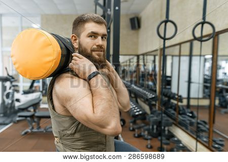 Military Sport, Muscular Caucasian Bearded Adult Man Doing Exercises In The Gym Dressed In A Bulletp